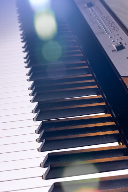 Close-up of an electronic piano keyboard in beautiful lighting.