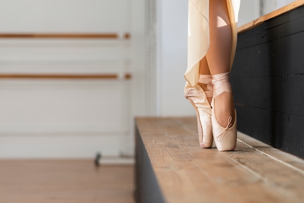 Close-up elegant ballerina dancing with grace