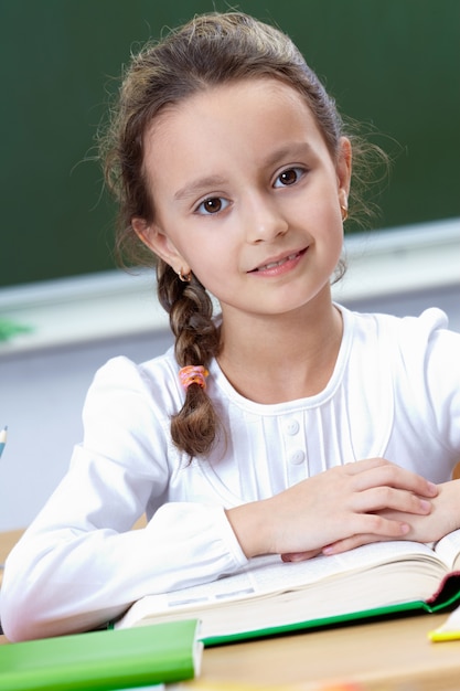 Close-up of elementary student with an open book