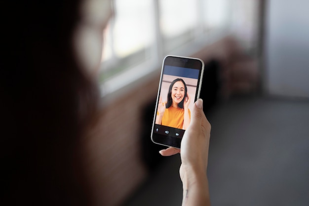 Close up employee holding smartphone