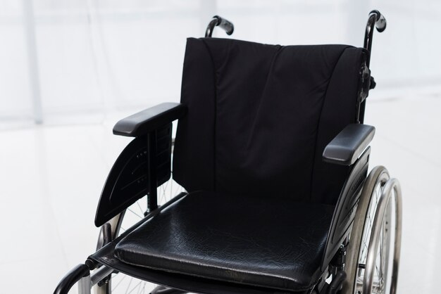 Close-up of an empty wheelchair in a room