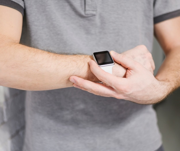 Close-up entrepreneur holding smart watch