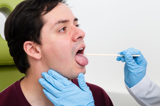 Close up examination with tongue depressor