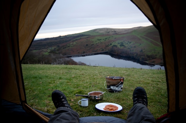 Free photo close up explorer laying in tent