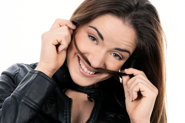 Close-up face of beautiful smiling woman with long hair