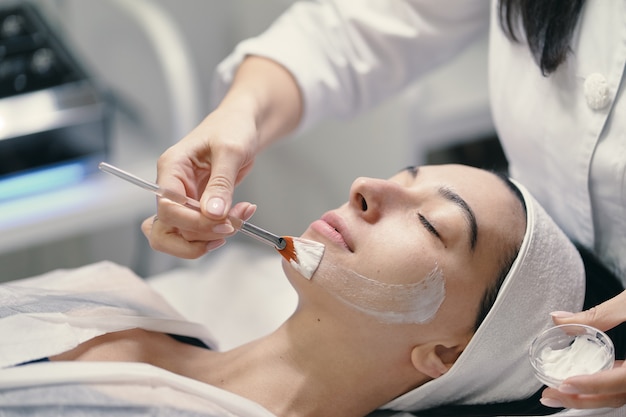 Close-up of the face of a young woman relaxing under the gentle