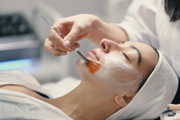 Close-up of the face of a young woman relaxing under the gentle