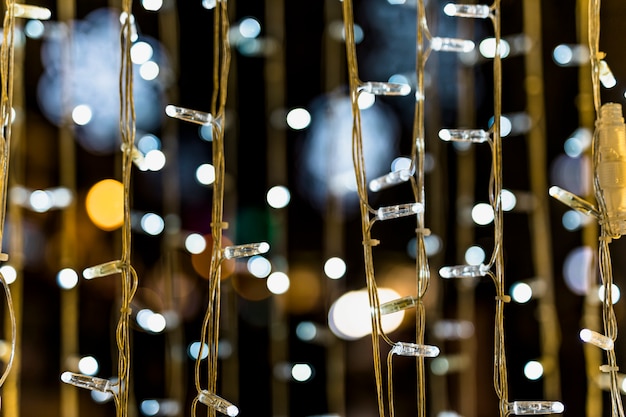 Close-up of fairy light against bokeh background