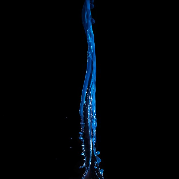 Close-up of falling blue water isolated on black background