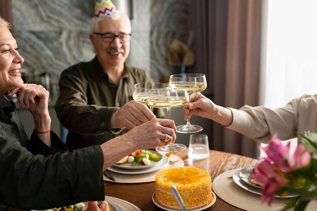 Close up family clinking glasses