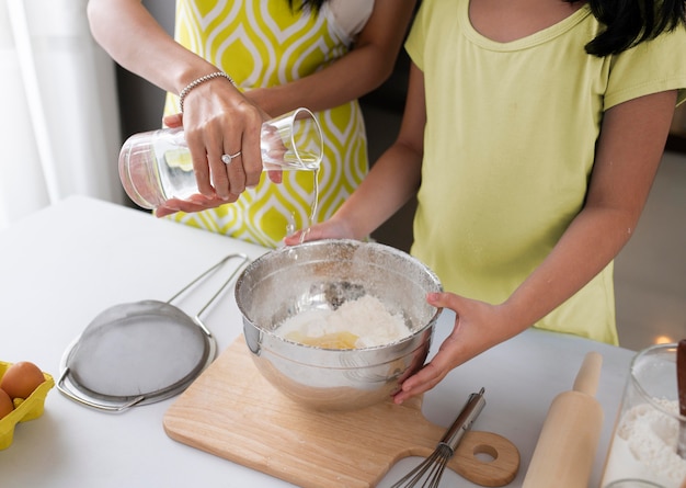 Close up family cooking