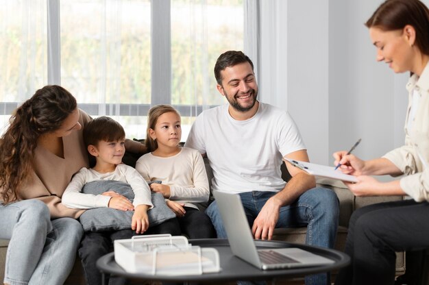 Close up family talking to therapist