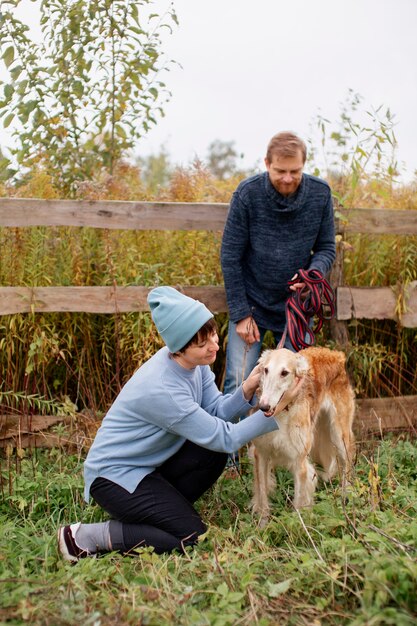 Close up on farmer spending time with dog