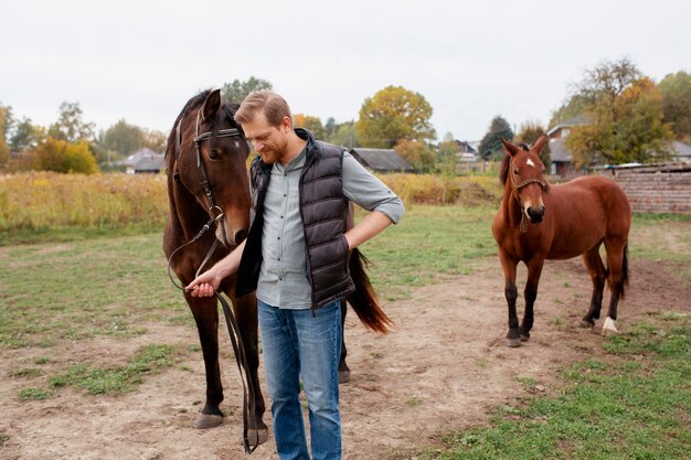 Close up on farmer with beautiful horse