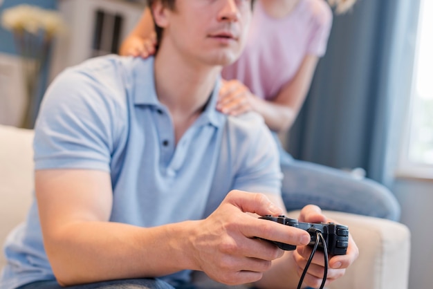 Close-up father playing video games