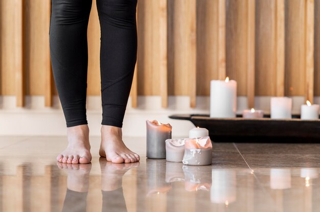 Close up feet and candles