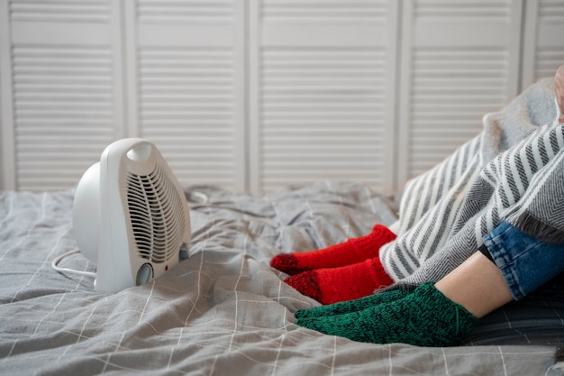 Close up feet getting warm at home