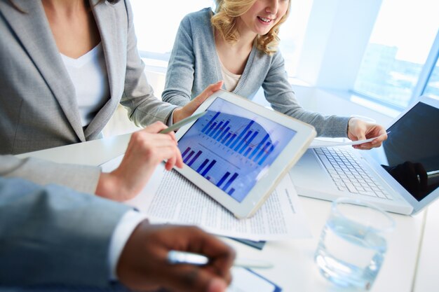 Close-up of female executive with digital tablet