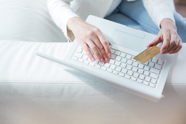 Close-up of female hands making online payment