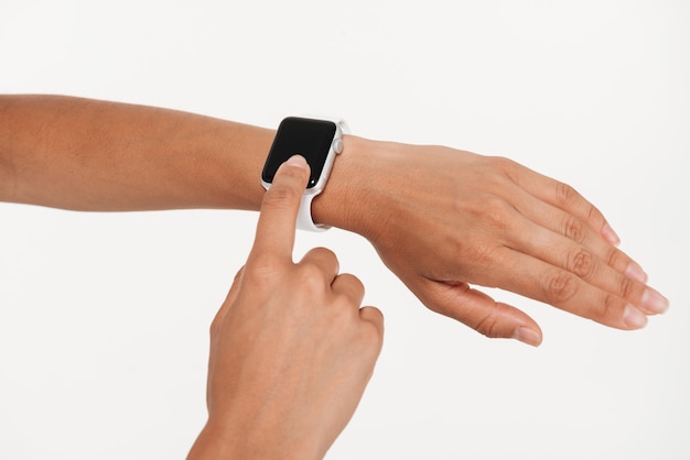 Close up of female hands using wrist smart watch