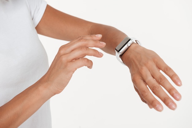 Close up of female hands wearing wrist watch