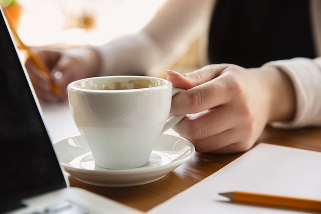 Close up of female hands, working in office