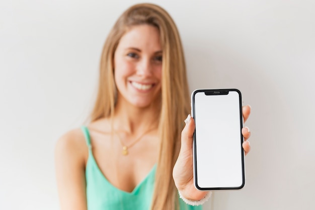 Free photo close-up female hoding mobile mock-up