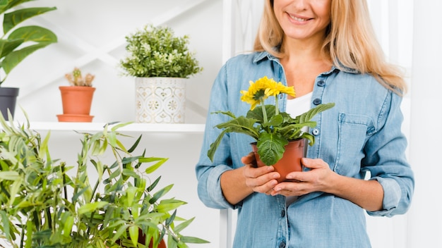 Close-up female holding flower pot