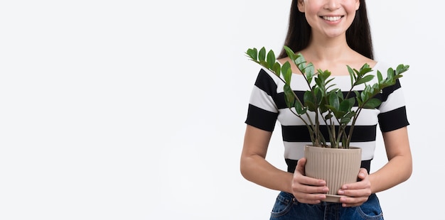 Close-up female holding flower pot