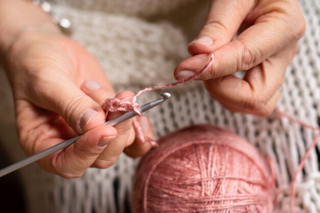 Close-up female knitting