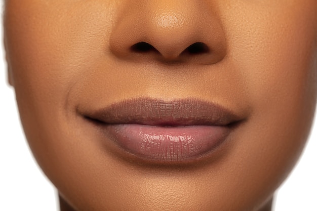 Close up of female lips with nude make up. . Beauty, fashion, skincare, cosmetics concept.