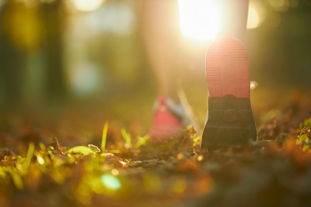 Close up of female runner wearing sneakers outdoors