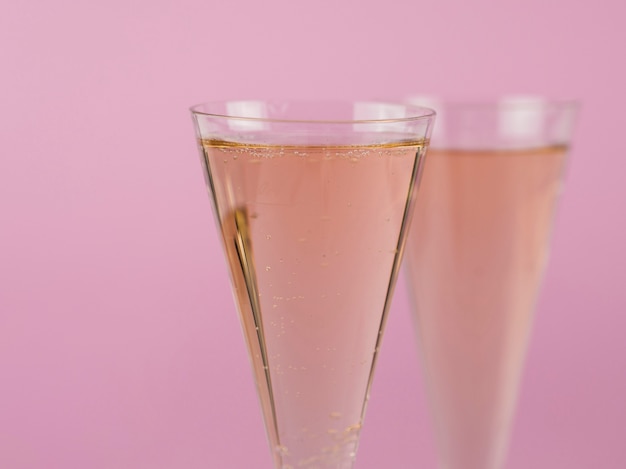 Close-up of filled champagne glasses