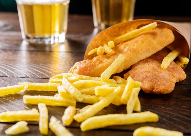 Close-up of fish and chips in paper cone