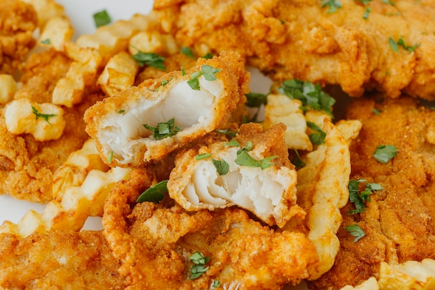 Free photo close-up of fish and chips with herbs