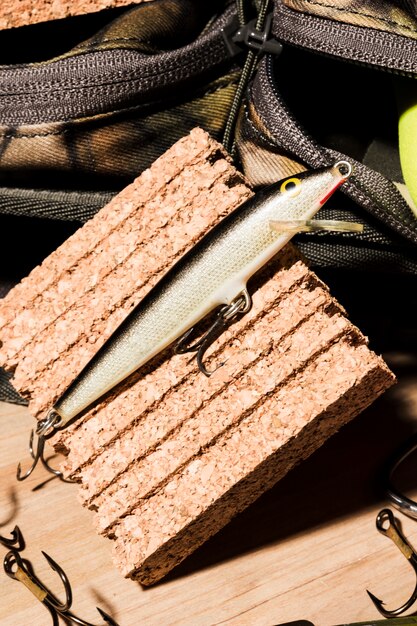 Close-up of fishing bait on cork board