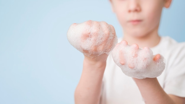 Free photo close-up foam on hands