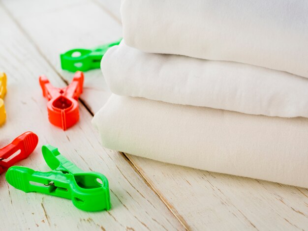 Close-up folded clean towels with clothes pin