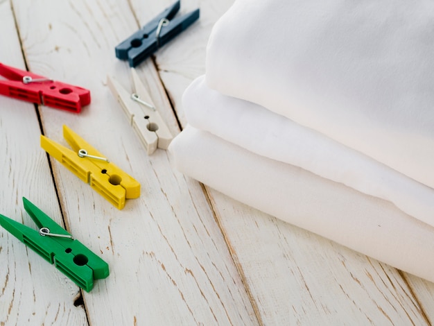 Close-up folded clean towels with clothes pin