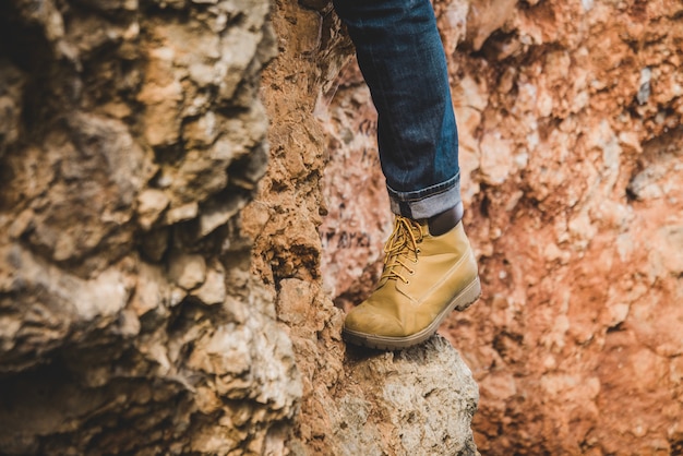 Close-up of foot on a rock