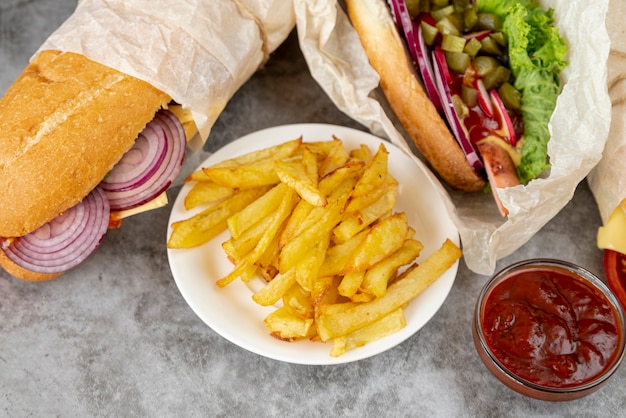 Close-up french fries with sandwiches