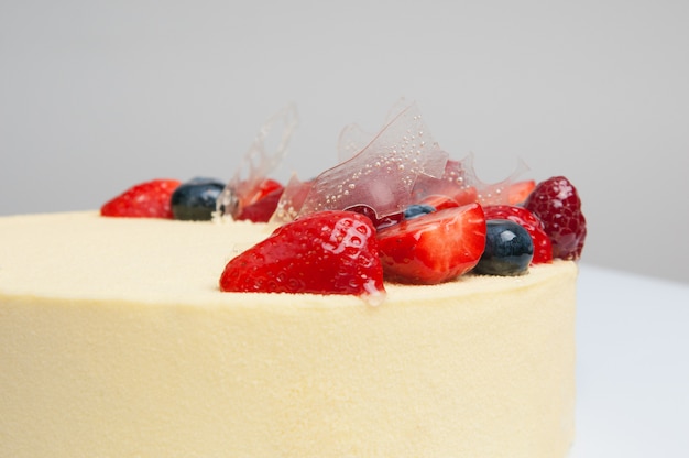 Close-up of fresh cake decorated with berries