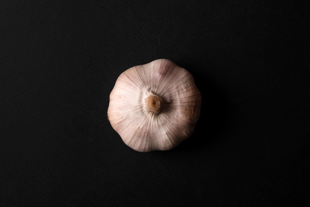 Close up of a fresh garlic isolated over black
