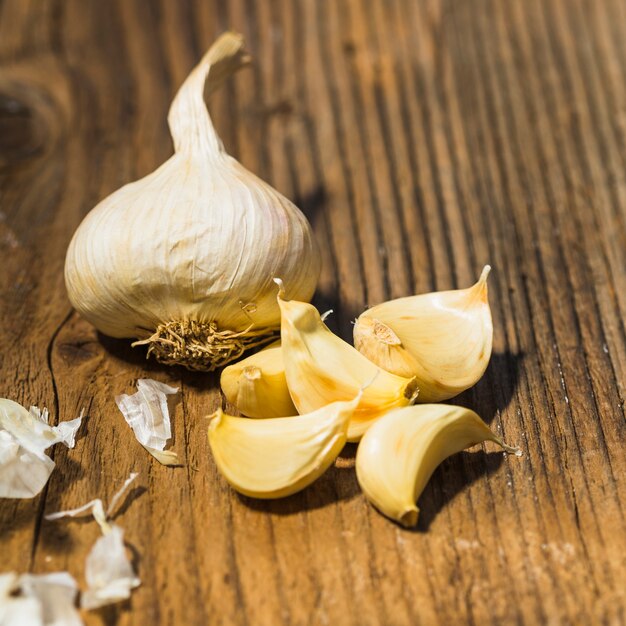 Close-up of fresh garlic on wooden surface