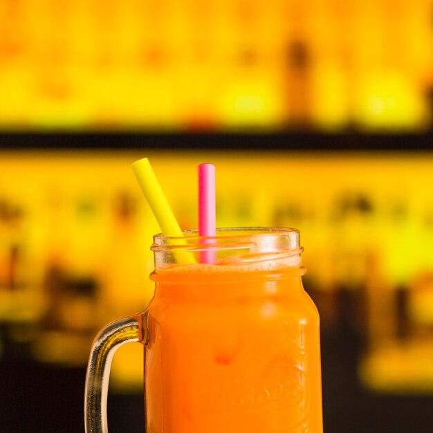 Close-up of fresh juice in mason bar