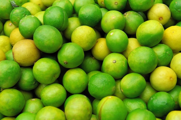 Close up fresh juicy limes on pile