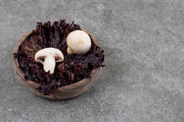 close-up-fresh-mushrooms-with-green-wooden-bowl_114579-85682.jpg