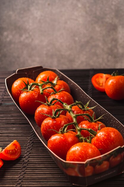 Close-up of fresh red tomatoes in tray