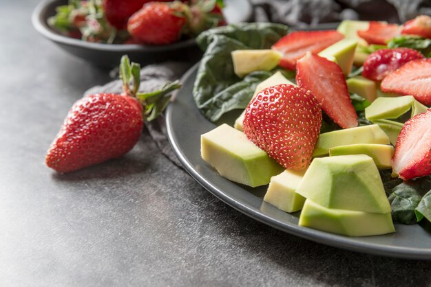 Close-up fresh salad with strawberries