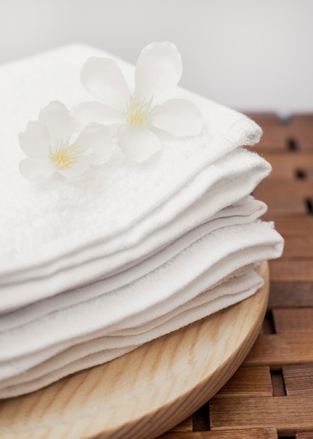 Close-up of fresh white flowers and towel